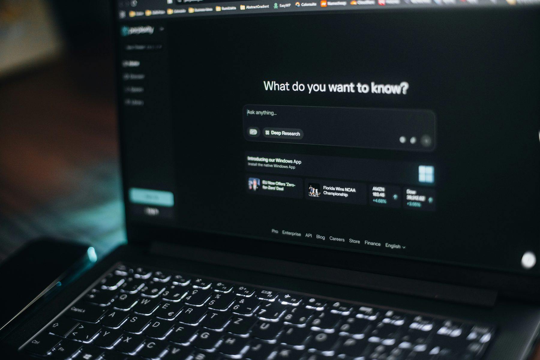 Laptop screen showing an AI search interface